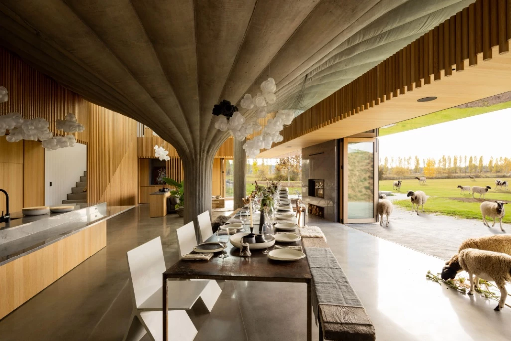 Sliding windows open the interior onto the adjoining large timber outdoor terrace