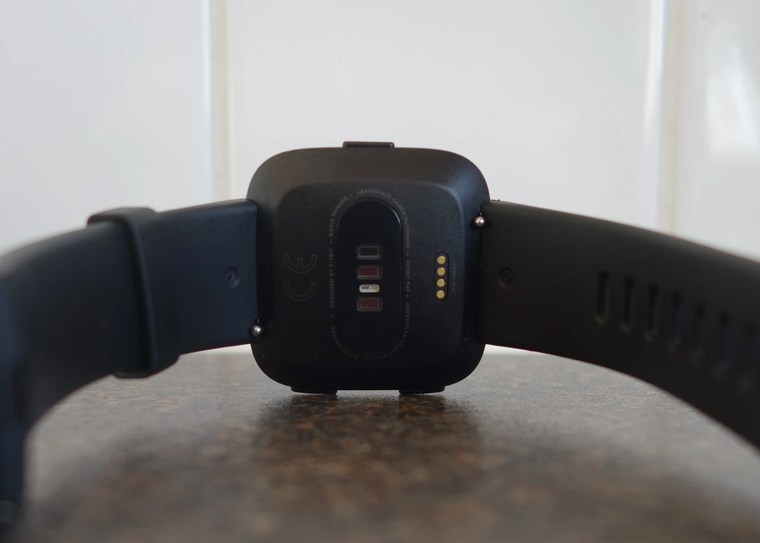 Around the back of the watch is the heart rate sensor and charging contacts
