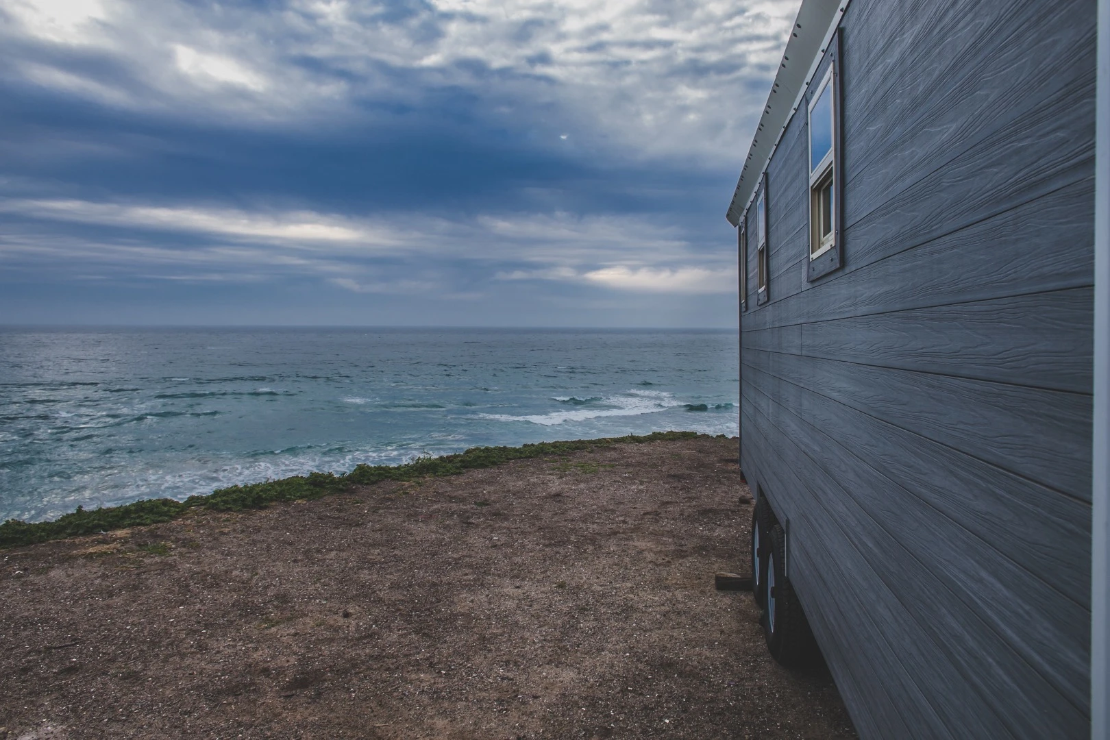 The towable Half/Half sits on a trailer and measures 20 ft (6 m) long, 8.5 ft (2.5 m) wide, and 13.6 ft (4.14 m) high