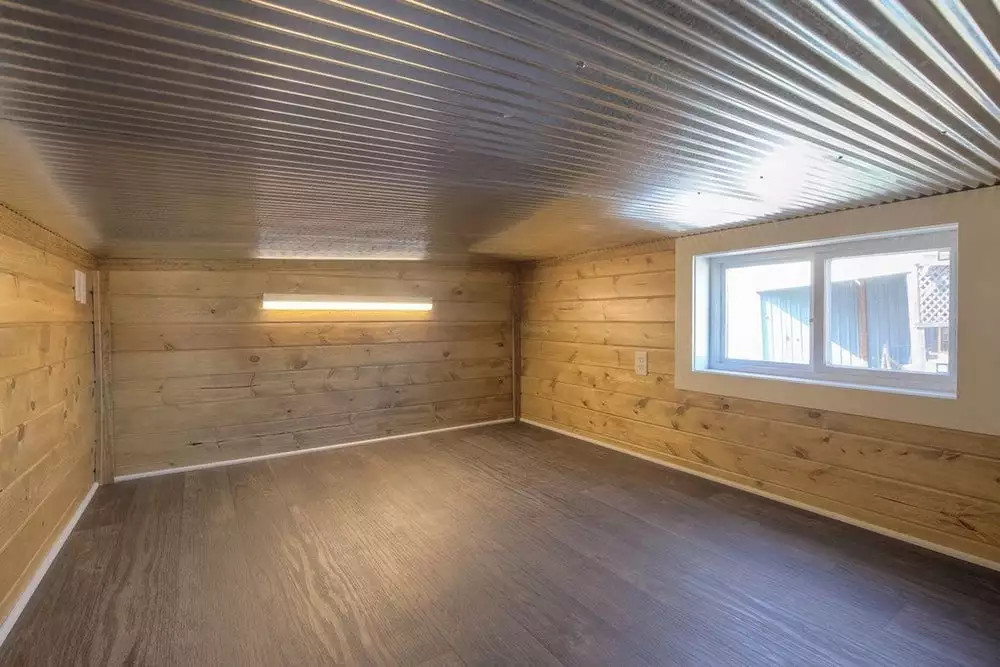 Custom Container Living's unnamed home's additional height allows for this loft bedroom