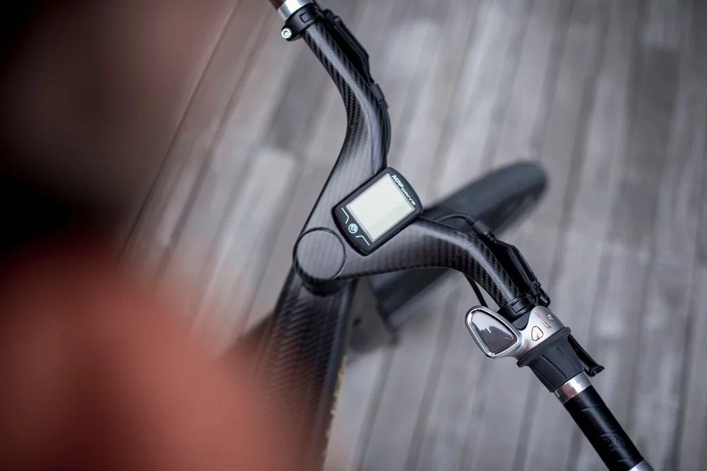 The carbon fiber handlebar has a digital display at the center