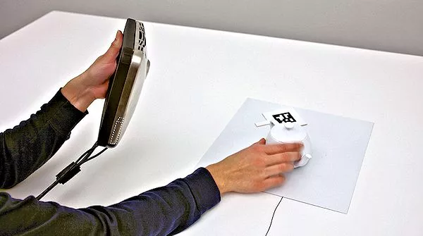 Touching a REVEL contact and the object on which textures are to be induced also works for displays (Photo: Disney Research)