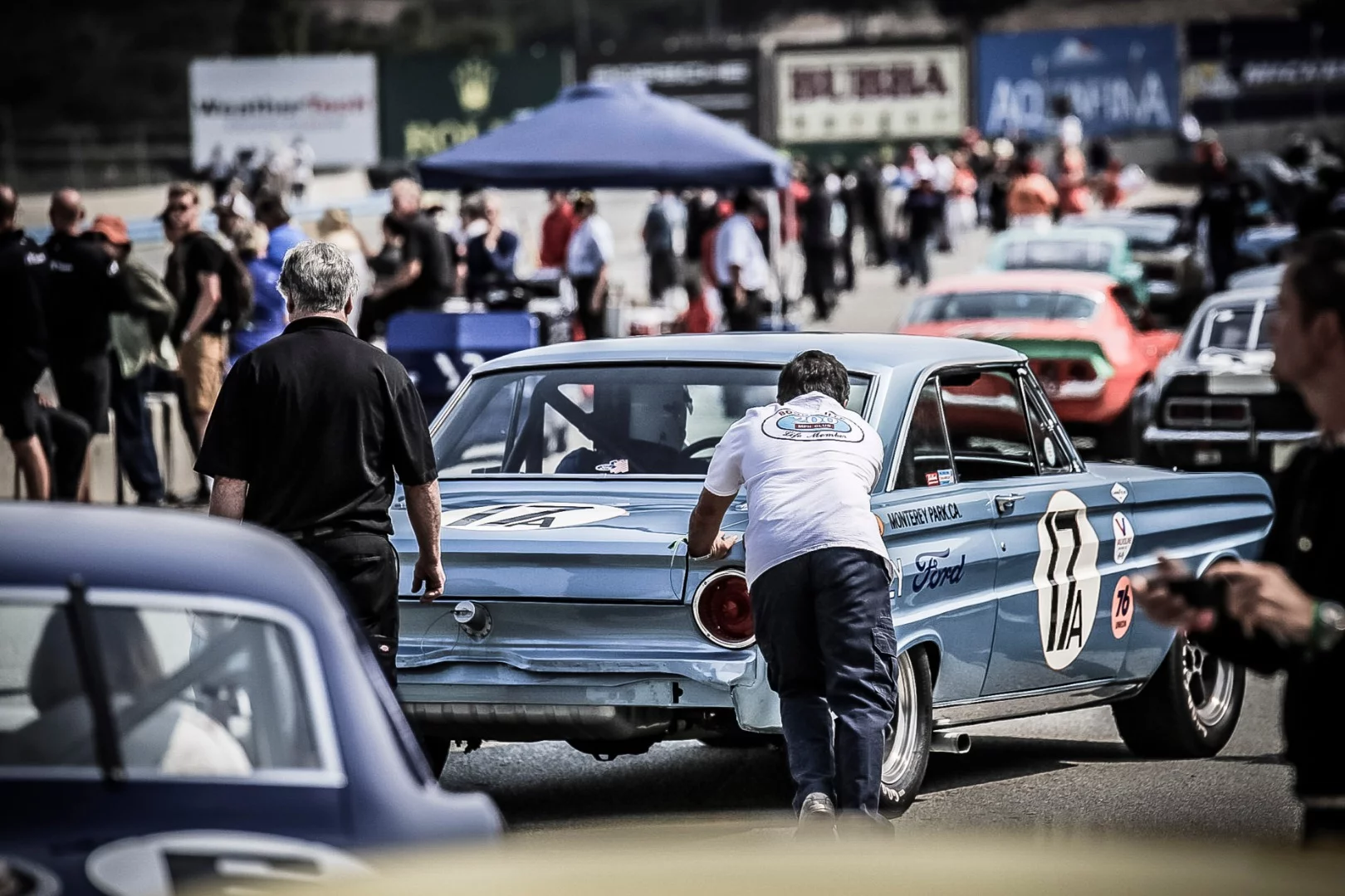 Pit lane at the Rolex Monterey Motorsports Reunion features everything from this 1964 Ford Falcon to 1930 era Alfa Romeo's