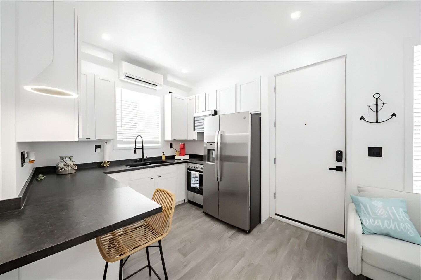 The kitchen has a full-size refrigerator and oven/stovetop