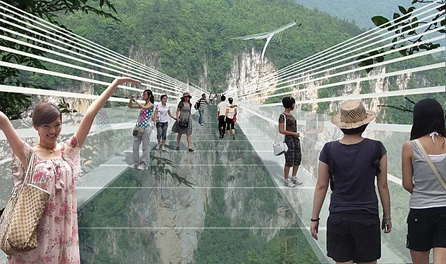 An artist's concept of people walking across the glass bridge high above the Zhangjiajie canyon in China