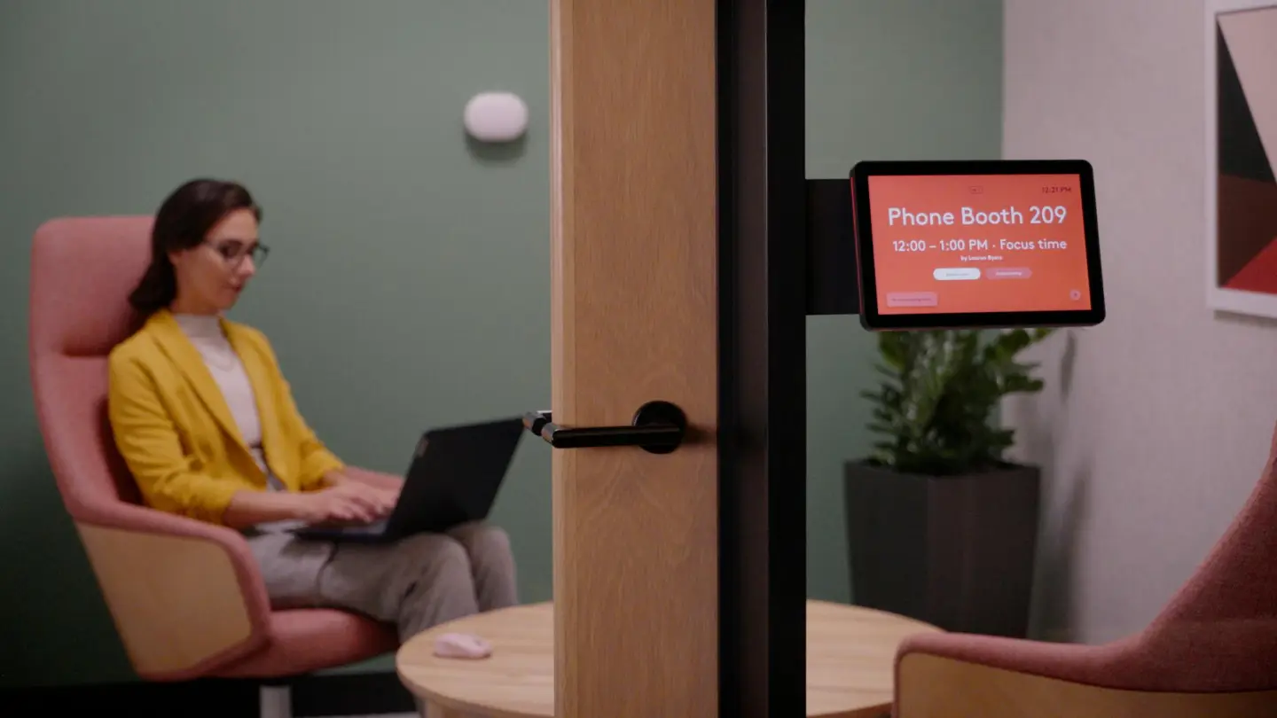 Live room telemetry feeds into digital floor plan displays, helping employees navigate the office and find available workspaces