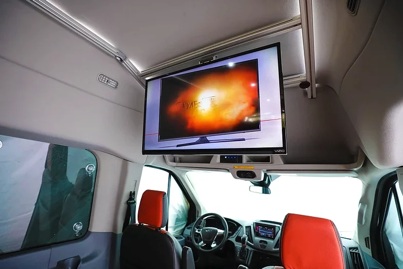 The television can be mounted inside the cabin, at the back or inside the sliding door