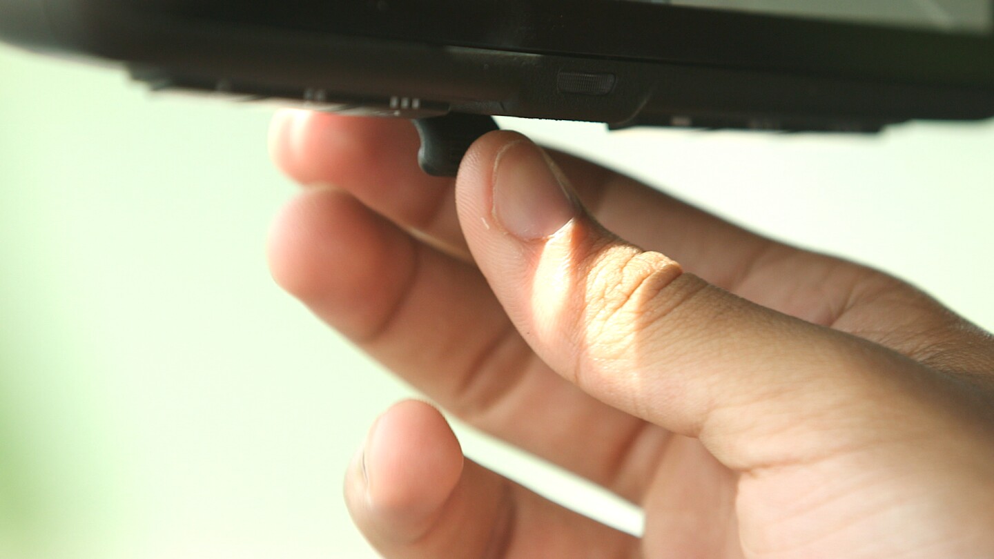 The I-RVM is switched from standard mirror mode to intelligent LCD mode with a switch located on the bottom of the mirror