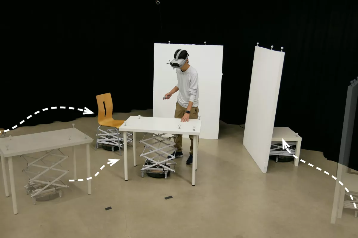 RoomShift is a VR system that uses robots to move furniture around a user to match the changing virtual environment