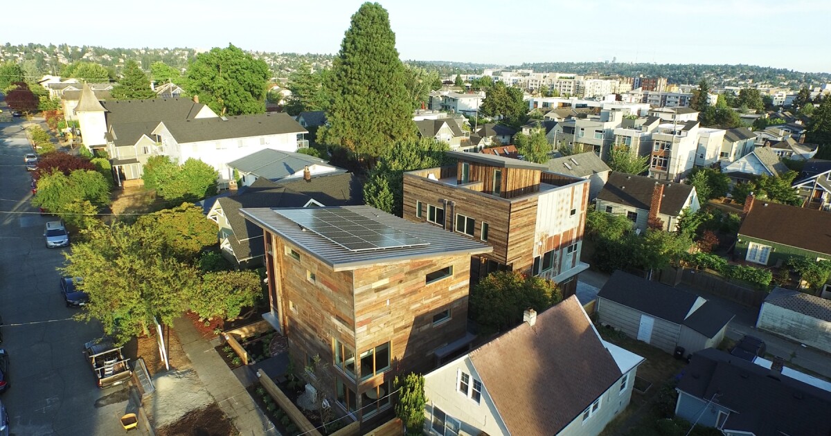The roof and window placement of the house is configured to maximize solar gain without sacrificing looks