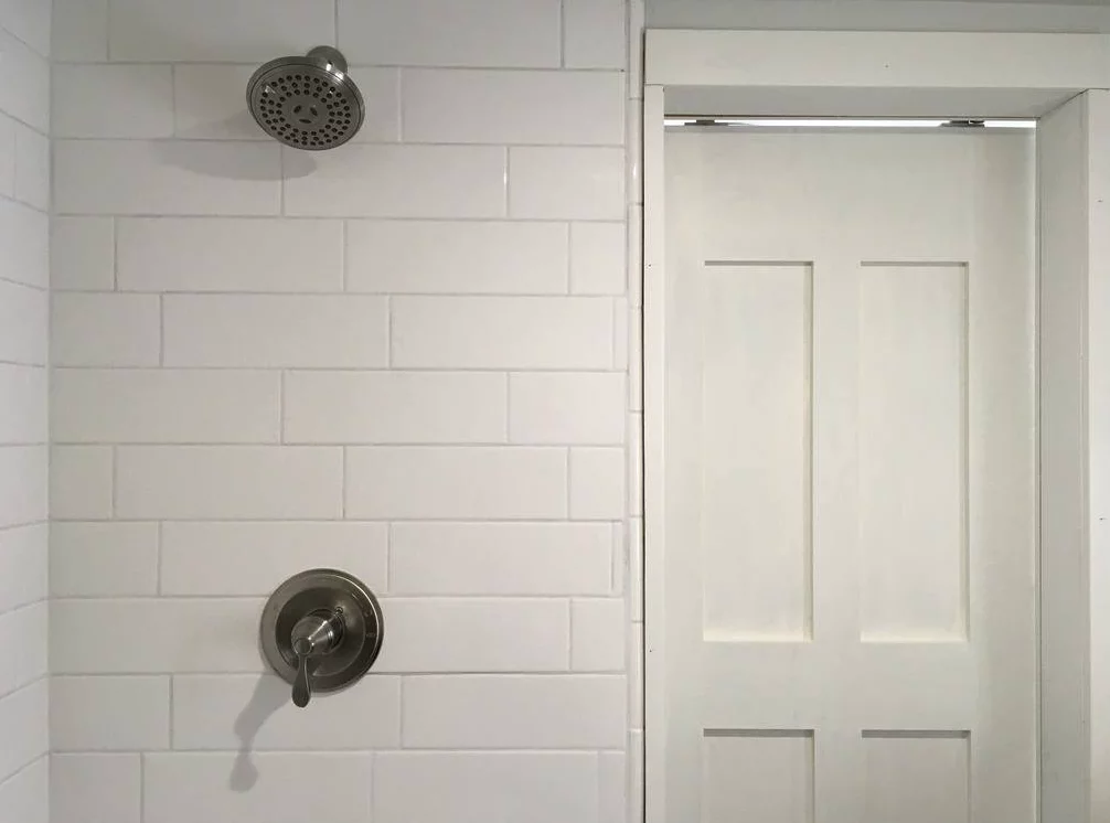 The intellectual Tiny Home's bathroom includes a full-sized shower