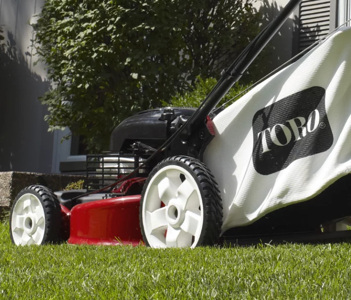 The mower features a variable speed self-propel system with a maximum of 3.25 mph (5.25 km/h) with front wheel drive and 11-inch rear wheels