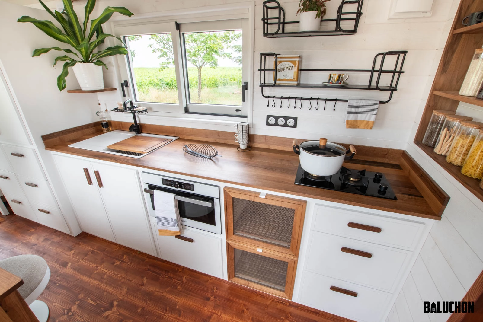 The Moulinsart's kitchen includes a ventilated storage area for fruit and vegetables, as well as quite a lot of cabinetry and shelving