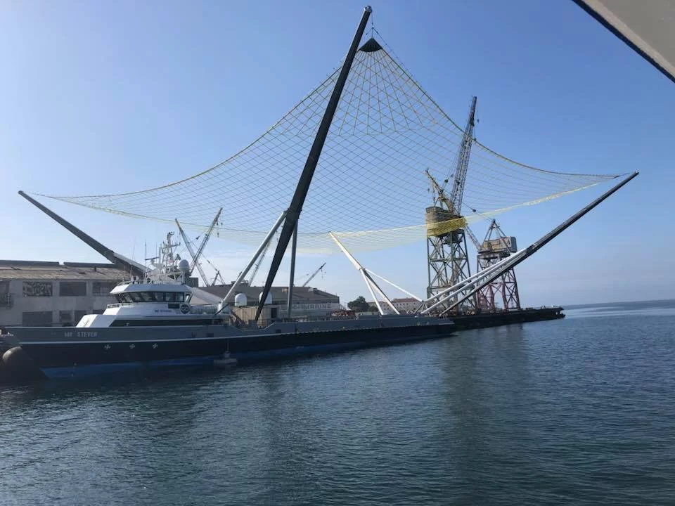 SpaceX uses a ship with a net to try and catch spent rocket fairings