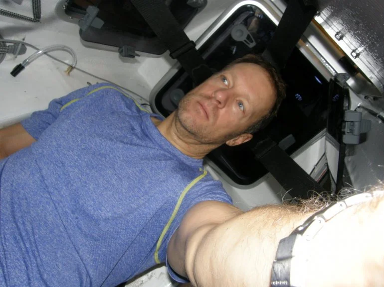 Greg Kolodziejzyk inside his pedal-powered boat, WiTHiN