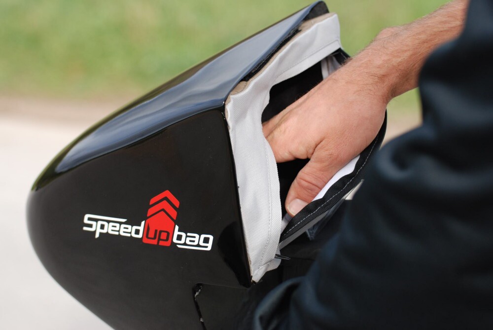 The base version of the bag has a waterproof plastic body, a capacity of four liters, and a zippered opening in the back, facing the rider