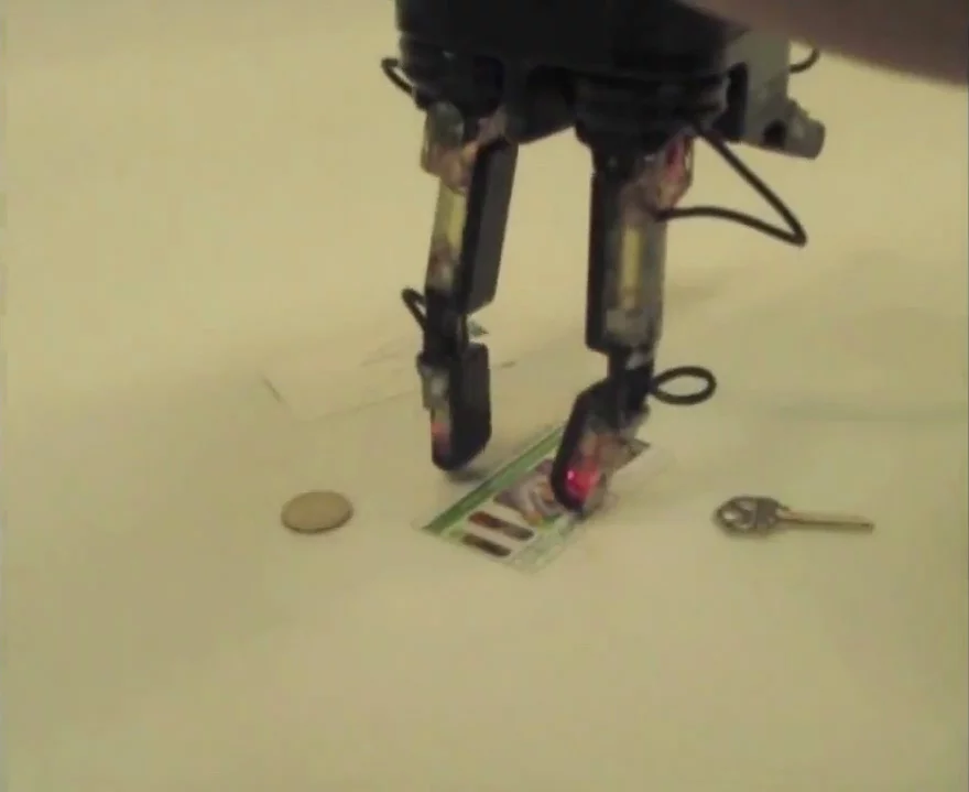 DARPA's ARM program hand can even lift a card off a table