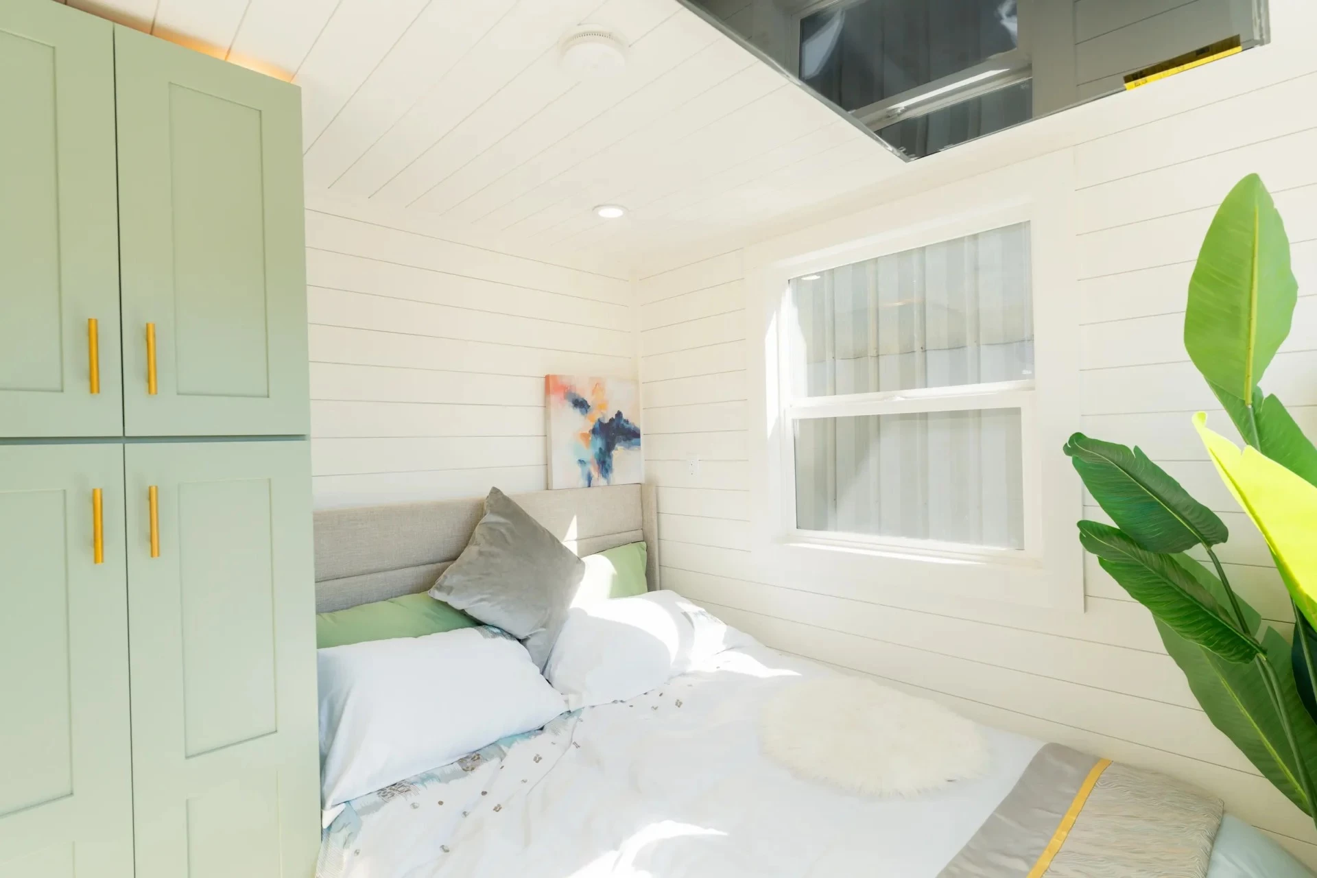 The master bedroom in the Avalon 32' is located downstairs and has ample headroom to stand upright