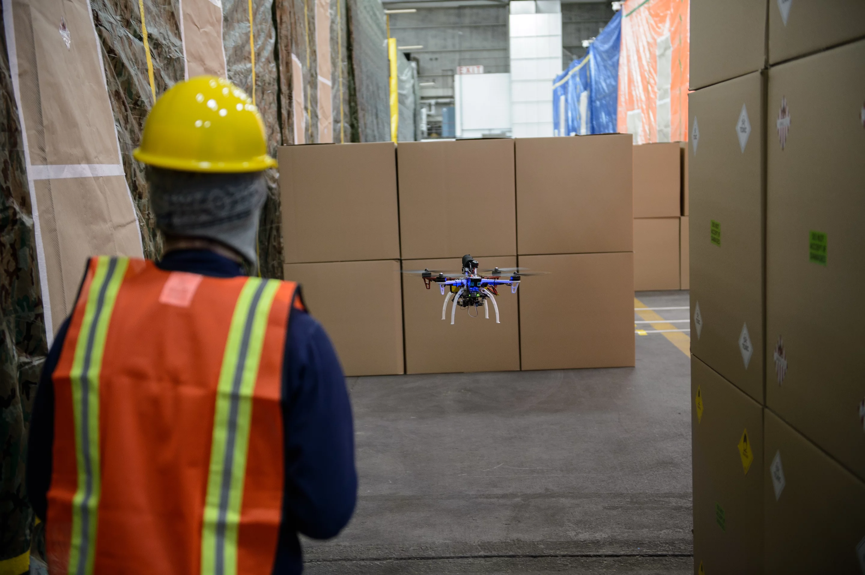 Technician following autonomous quadcopter