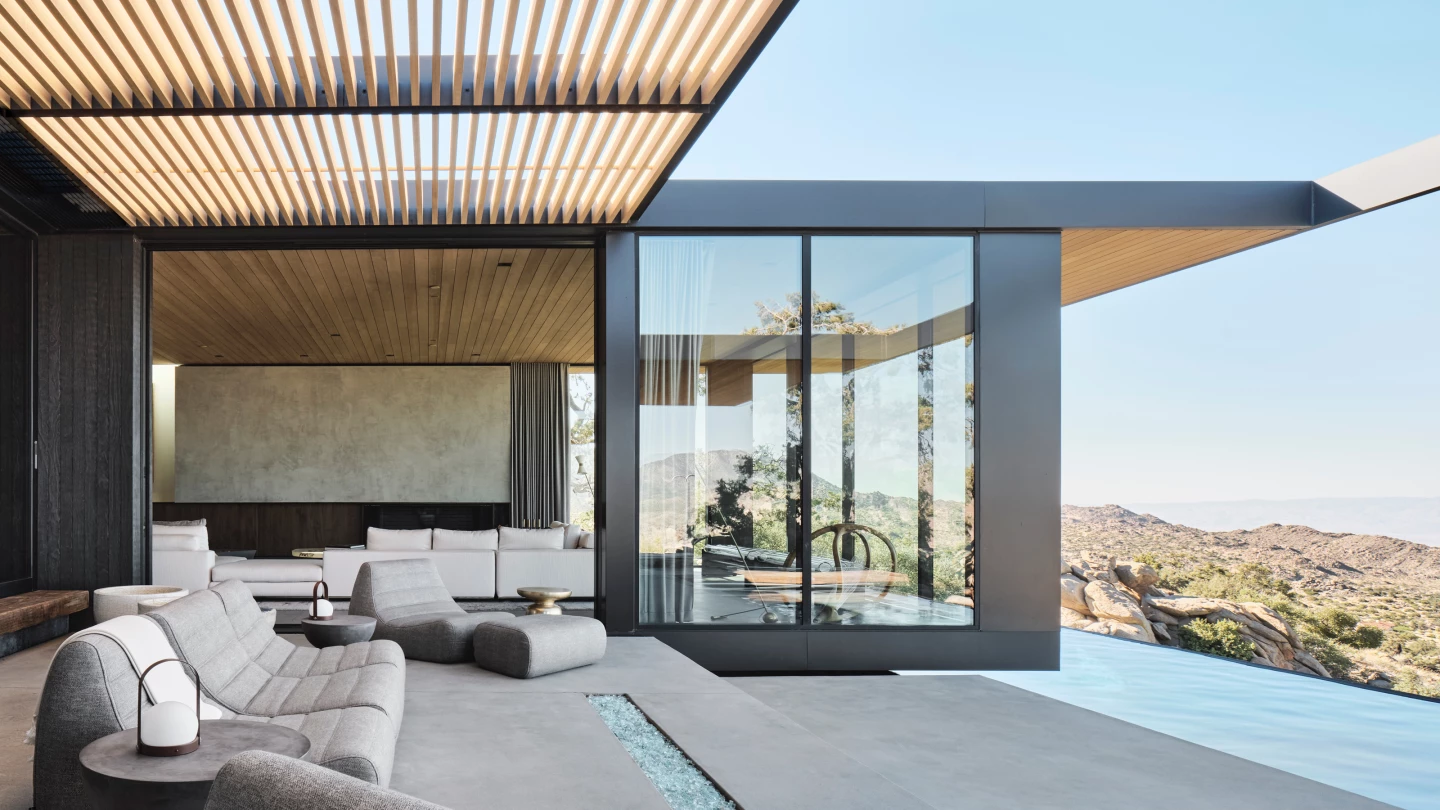 High Desert Retreat offers views of the beautiful landscape with generous glazing which opens in places to promote natural cooling