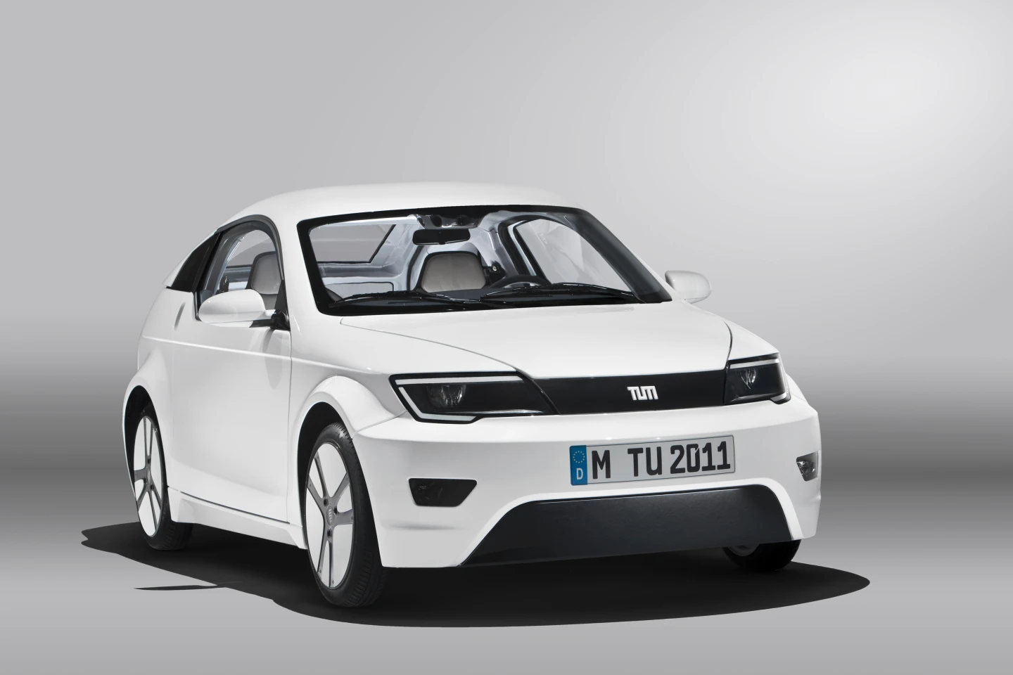 The sporty two seater electric coupe features a lightweight aluminum frame and carbon fiber reinforced plastic chassis