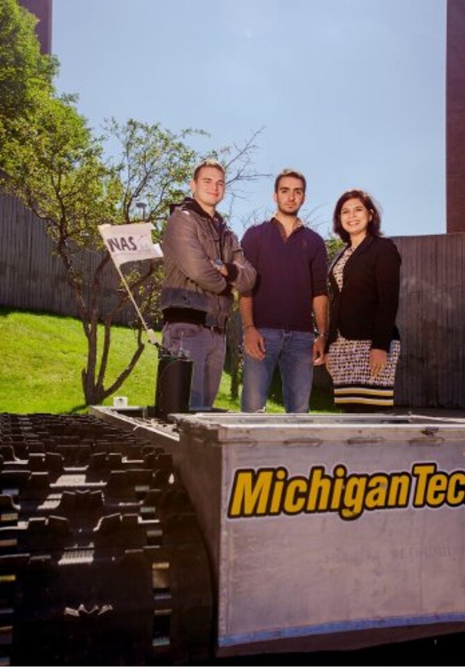 The Michigan Tech team and the robot to be used in future development