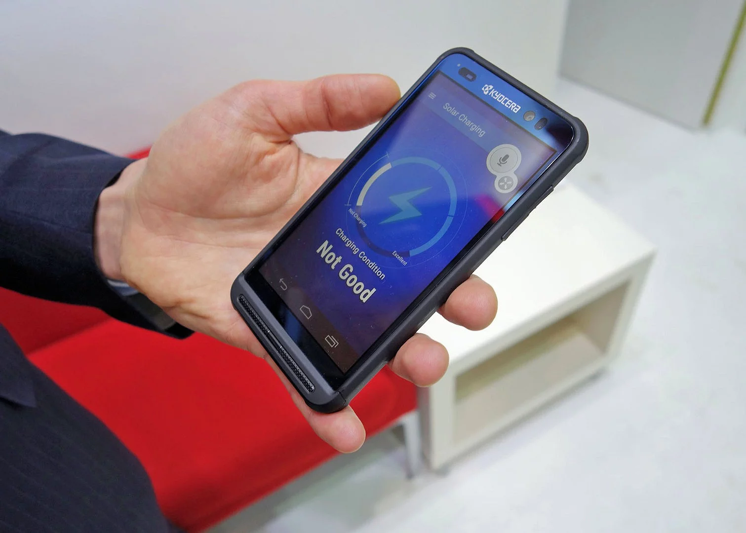 There's a solar-powered charging panel behind this phone's touchscreen, and the technology is almost ready for launch