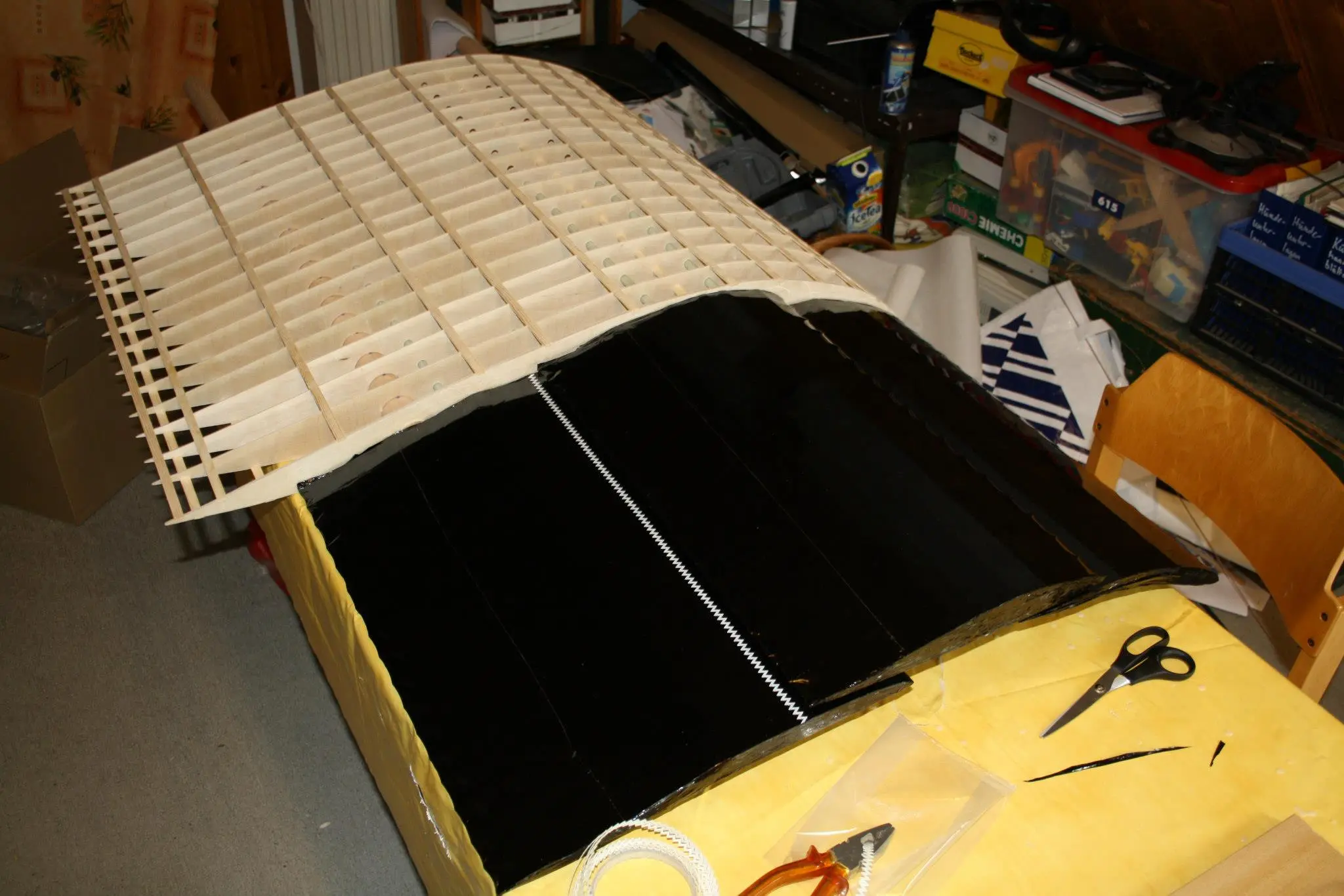 Wing assembly being covered