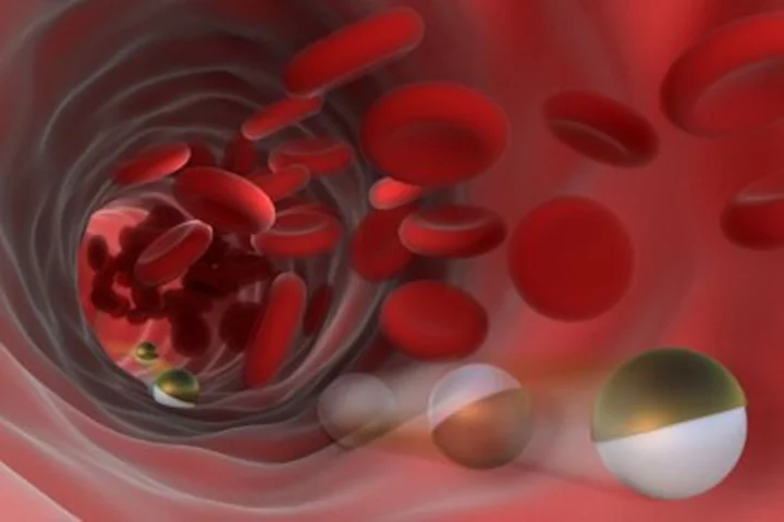 An artist's impression of micro-robots that roll through the bloodstream to deliver drugs