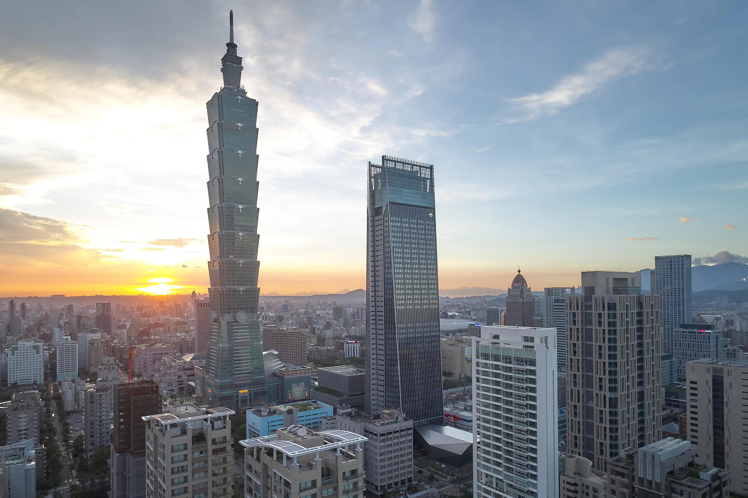 Nan Shan Plaza is located in Taipei, Taiwan. It rises to a height of 892 ft (271 m) and is the second-tallest building in Taipei, after the Taipei 101, which is also pictured. The skyscraper was designed by 48 Mitsubishi Jisho Sekkei Inc. and Archasia Design Group, and is a fourth place runner-up