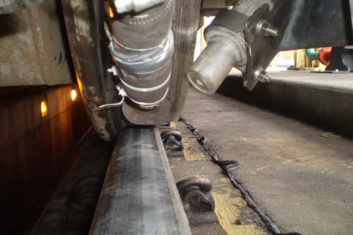 One of the Advanced Rail Cleaner's track-clearing nozzles points at the rail (Photo: GE Transportation)