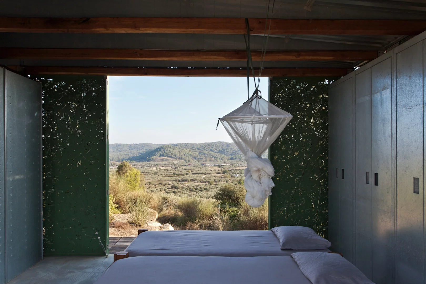 The Olive Tree House's bedroom offers a great view when the walls are open