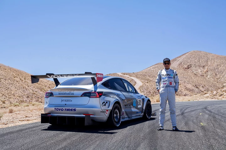 Daijiro Yoshihara alongside the modified Tesla Model 3 Performance