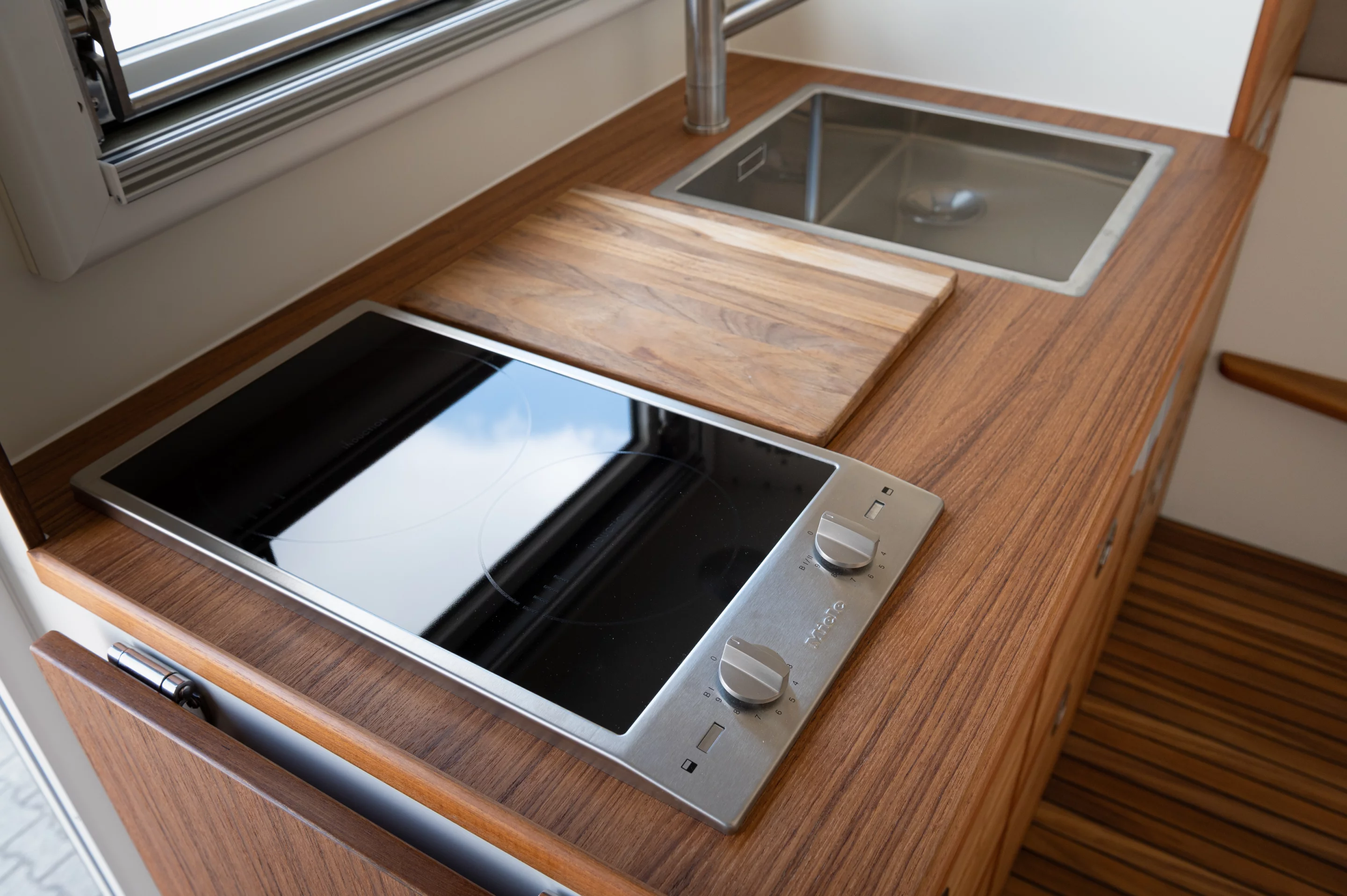 Induction cooktop and stainless steel kitchen sink