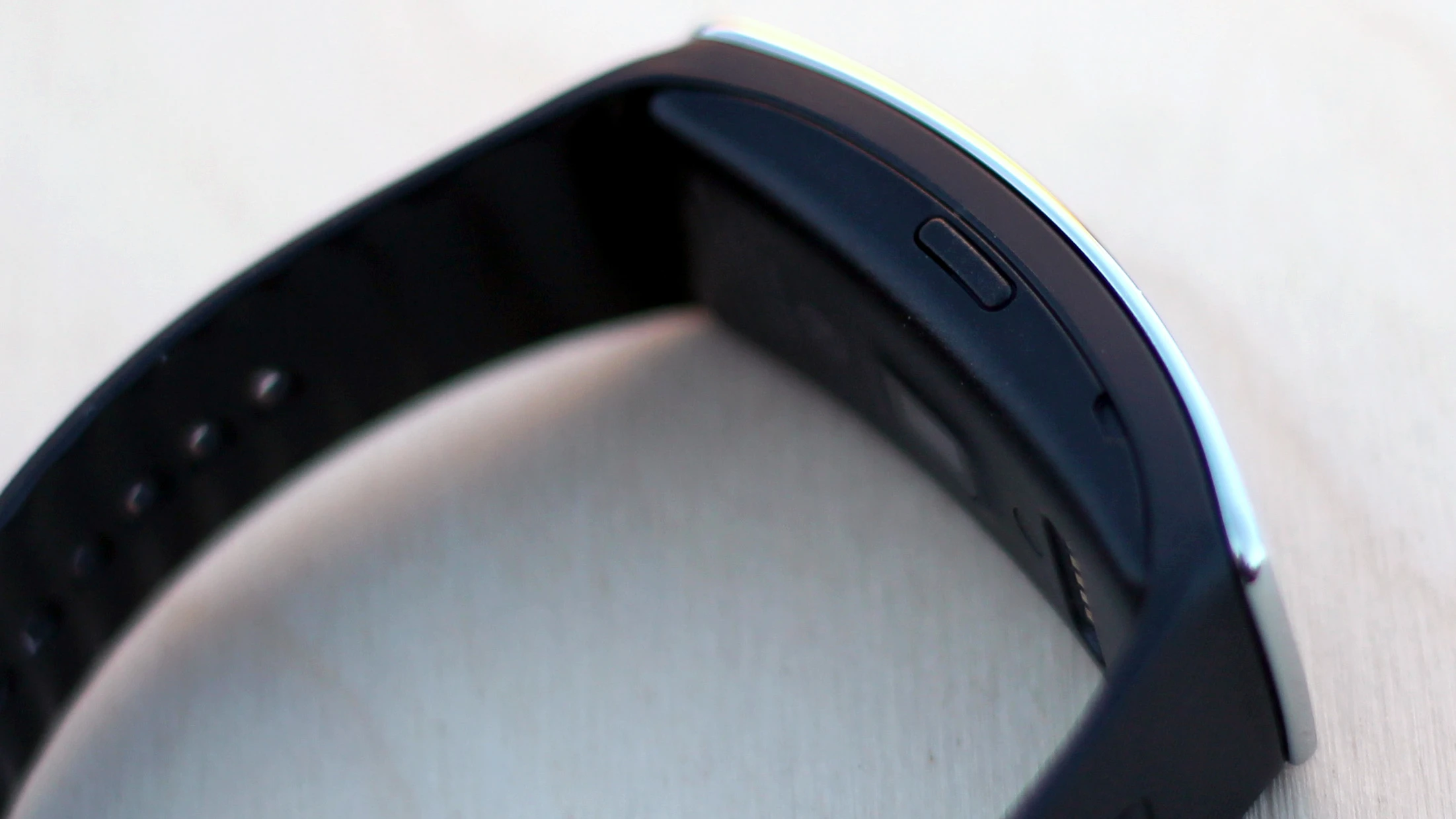 A lone power/sleep/home button sits on the Fit's side