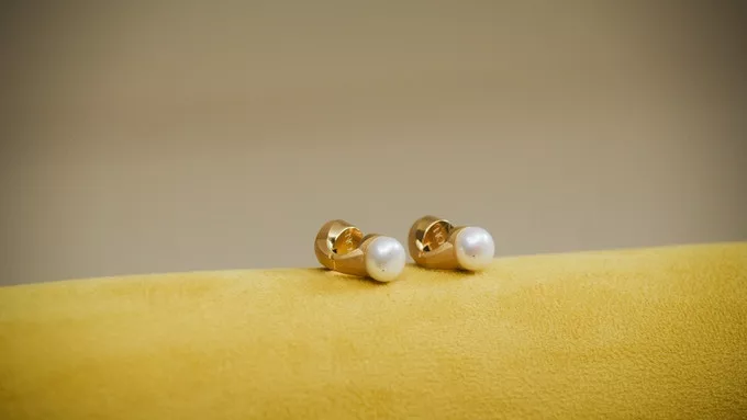The earrings are IPX4 water-resistant