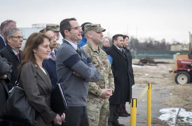Officials watch on as the US Army's 'hoverbike' takes flight