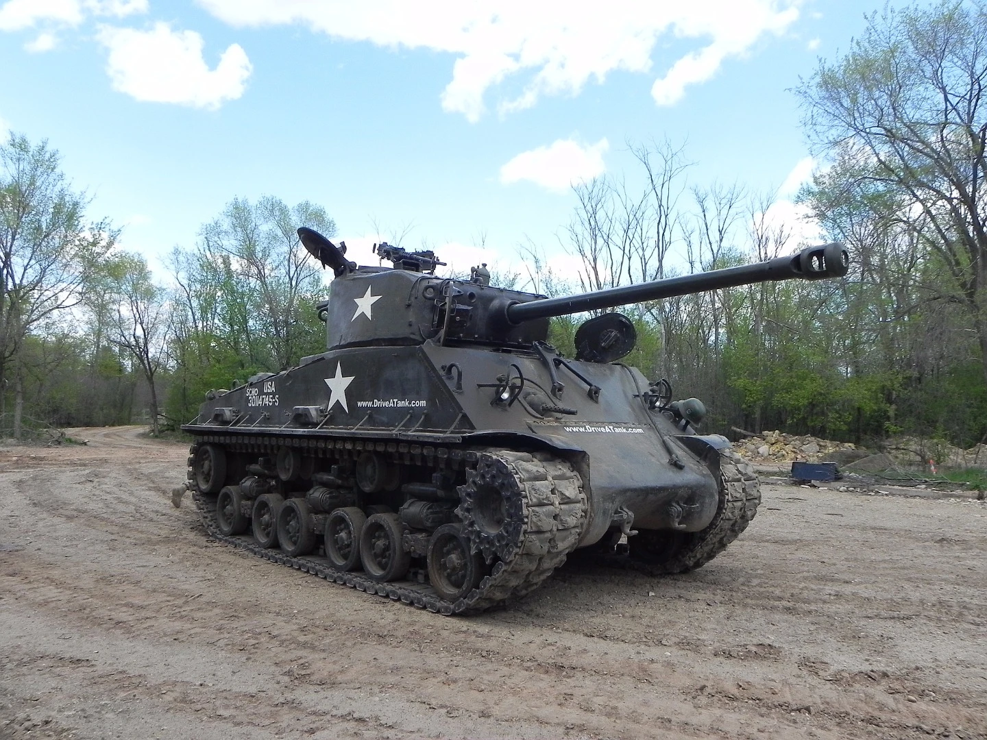 From this view, the driver sits to the right and the commander to the left, beneath the 76mm turret of the Sherman