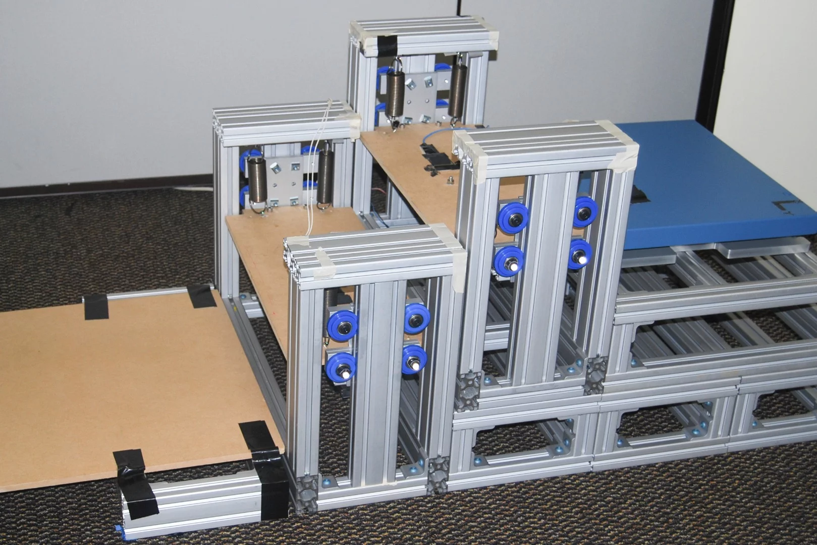 As a person descends the energy-recycling stairs, each step sinks and locks into place level with the one below it, and on the way back up, they rise again to take some of the strain off the ankles and knees