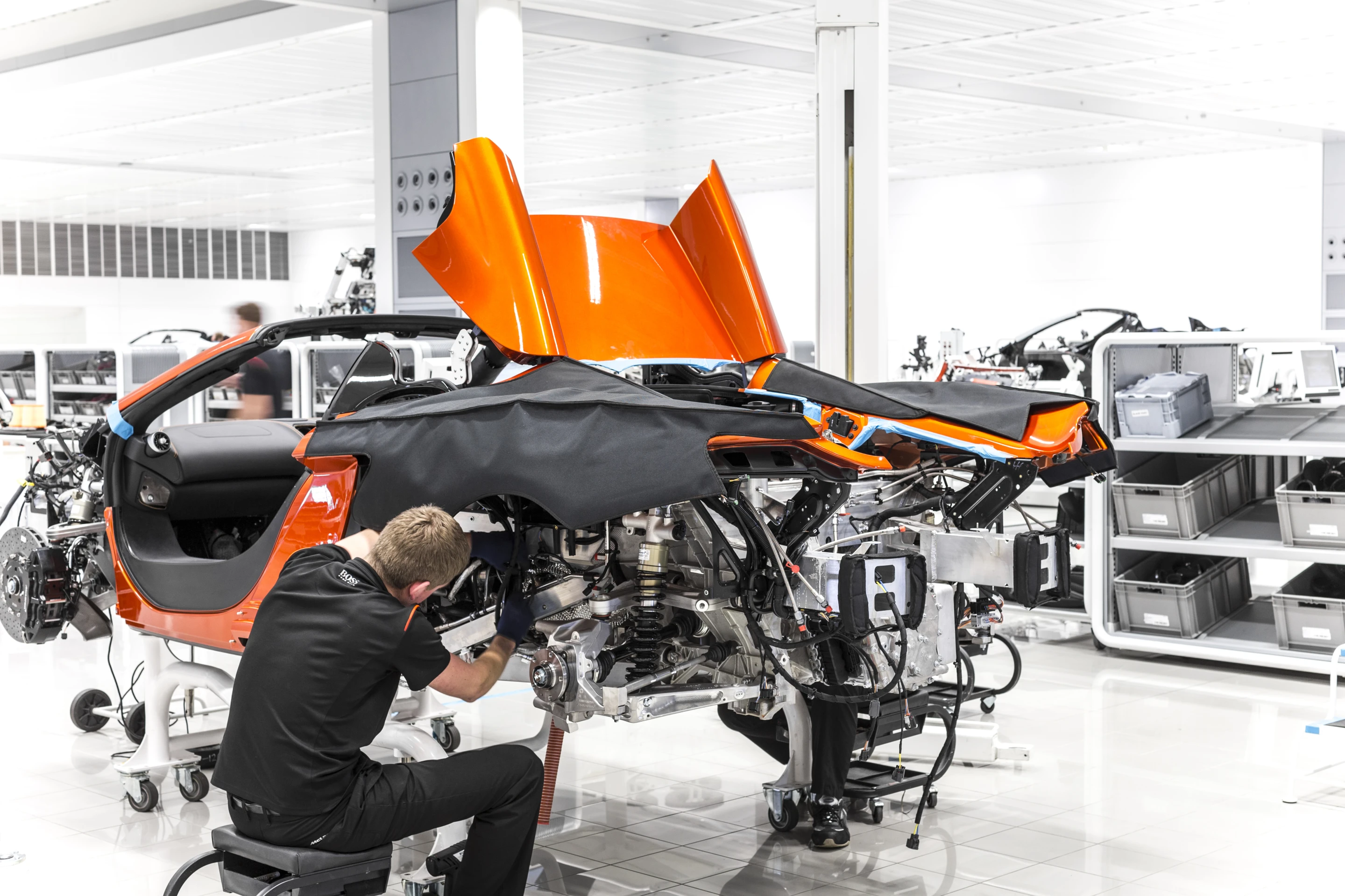 12C production shows engine and suspension installation, and foldable roof cover
