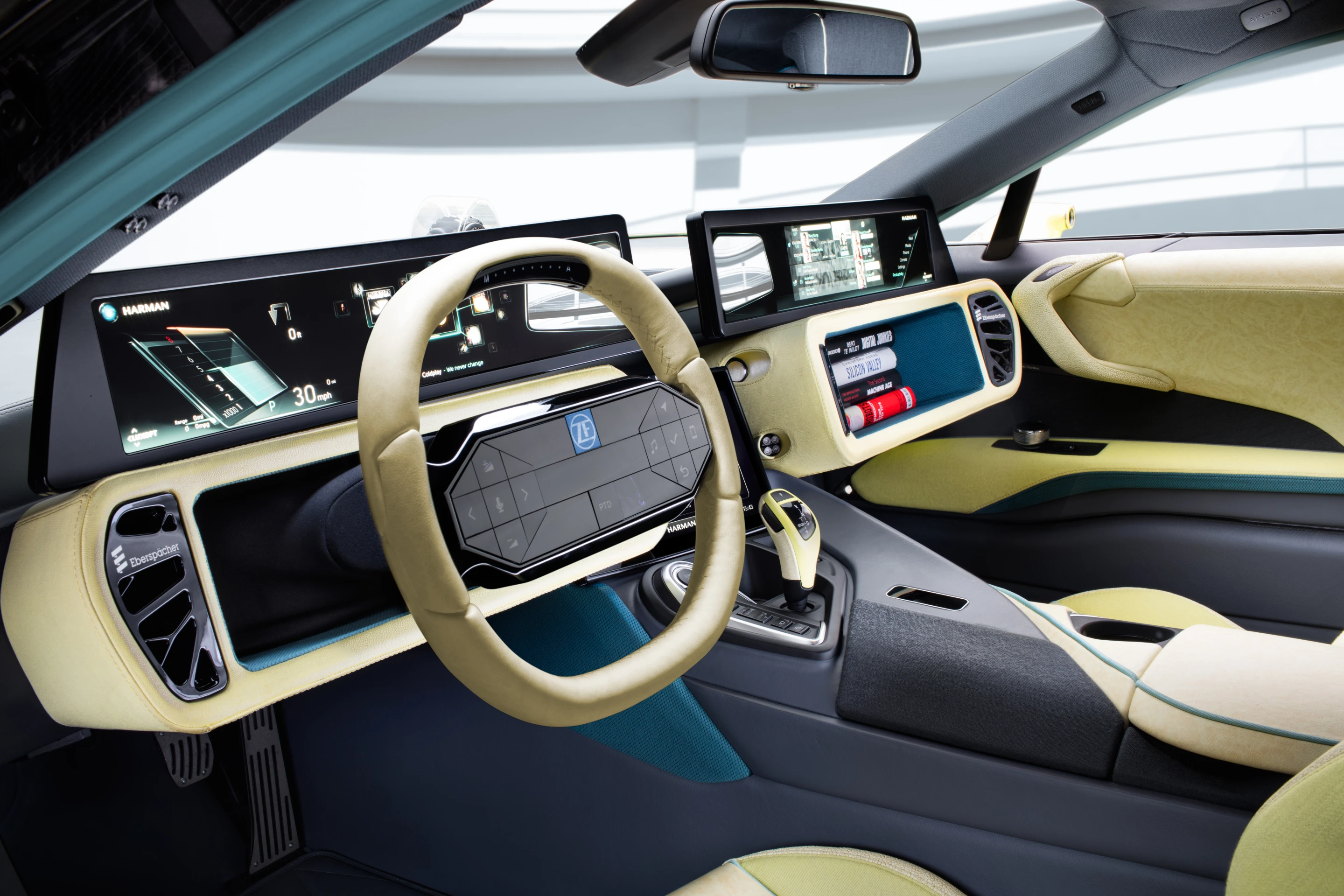 Rinspeed gives the driver the option of taking control with its slide-out steering wheel design