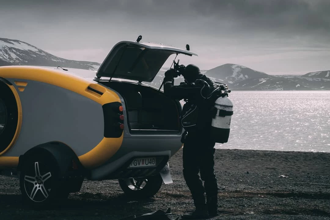 It's common to see camping trailers used for activities like mountain biking or surfing, but Icelandic scuba diving is a new and intriguing one