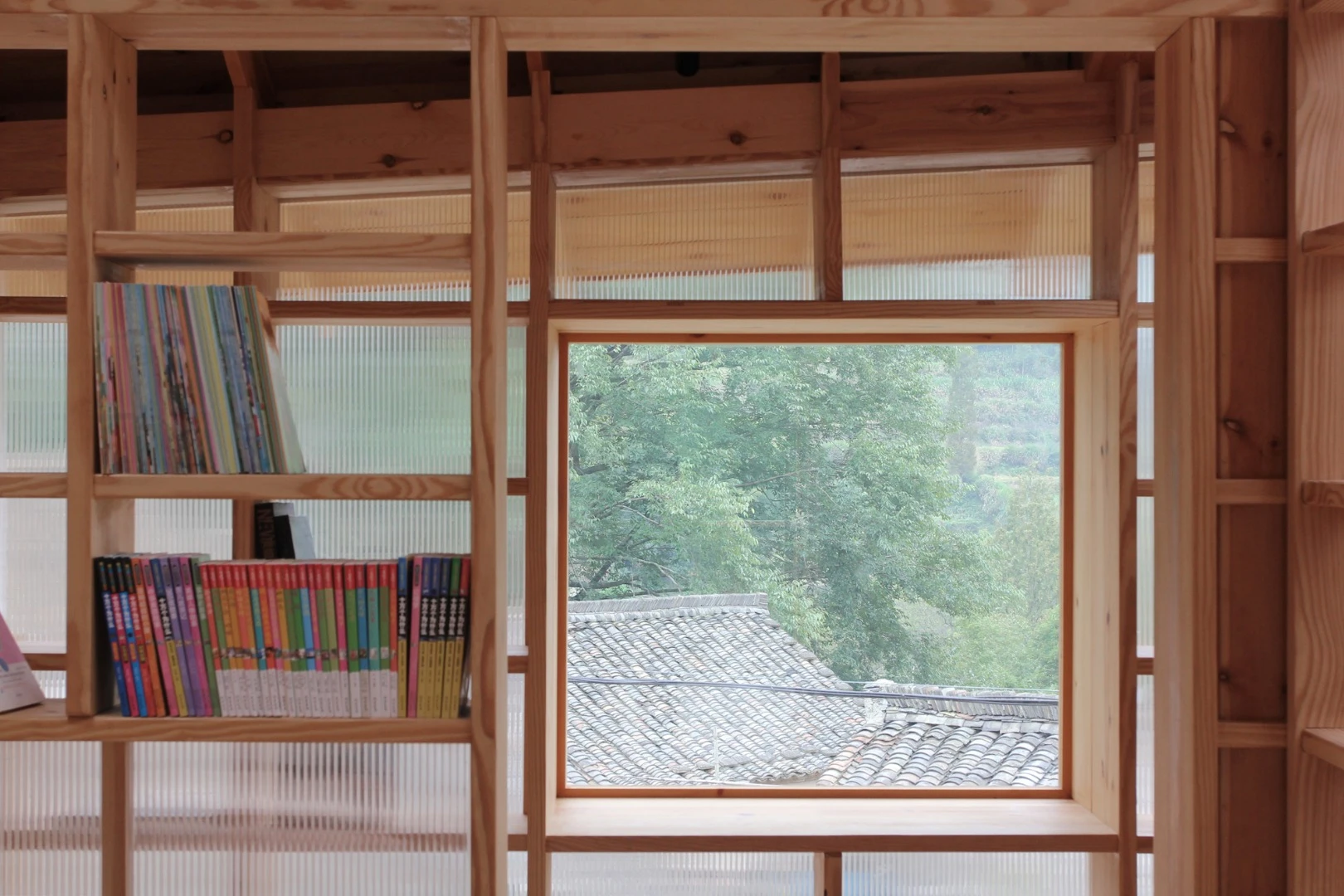 The raised building is located near to a children's playground and parents can sit, book in hand, while keeping an eye on their kids through the windows