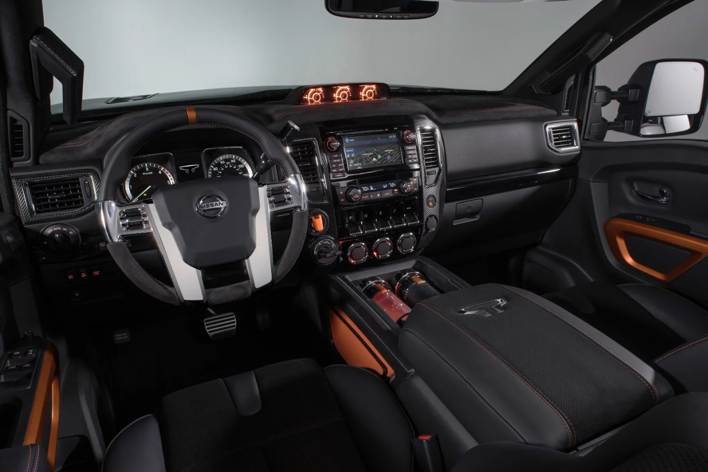 Inside, the Titan Warrior Concept includes a custom steering wheel, orange highlights and hot/cold drink holders