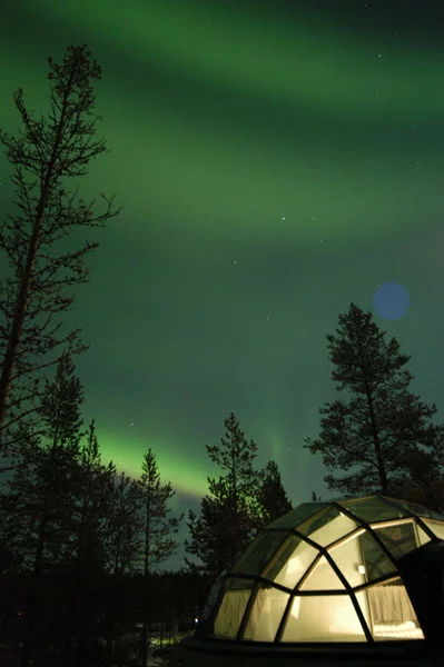 The night time light display of Aurora Borealis is caused by the collision of gaseous particles from the earth's atmosphere, with charged particles released from the sun's atmosphere (image from Hotel Kakslauttanen)