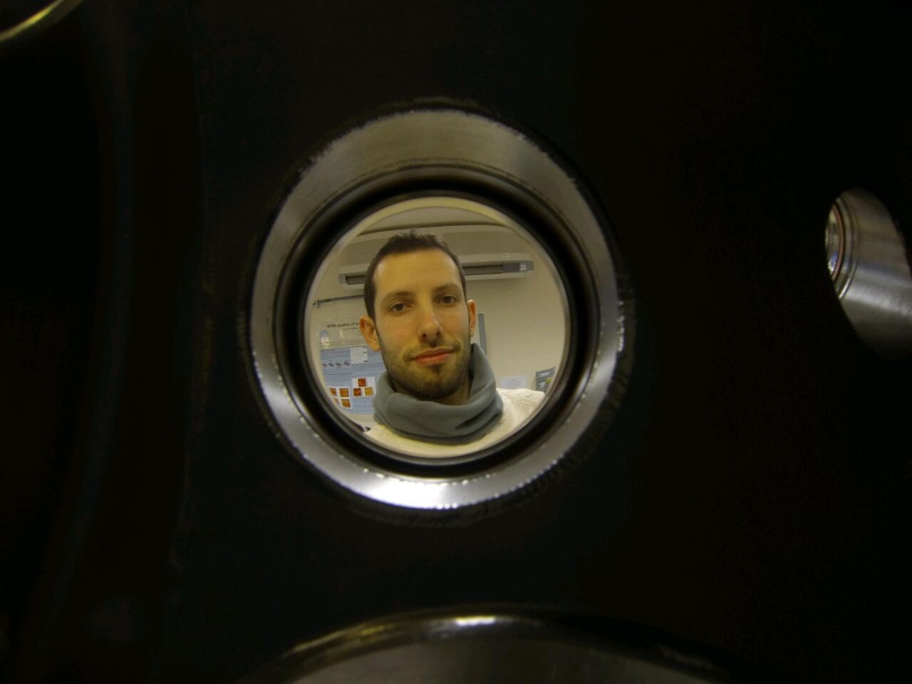 Dr. Hugo Dominguez looks into the chamber where the C14 diamond layers are 