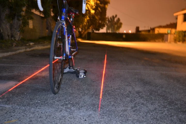 Xfire’s Bike Lane Safety Light uses lasers to project a bicycle lane onto the road around around a cyclist