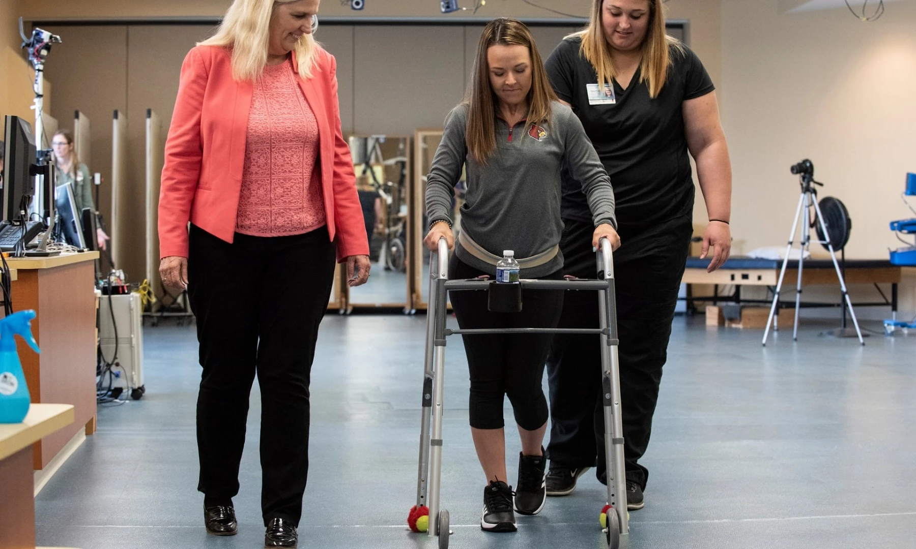 Kelly Thomas (center) walks independently after success with the new groundbreaking treatment