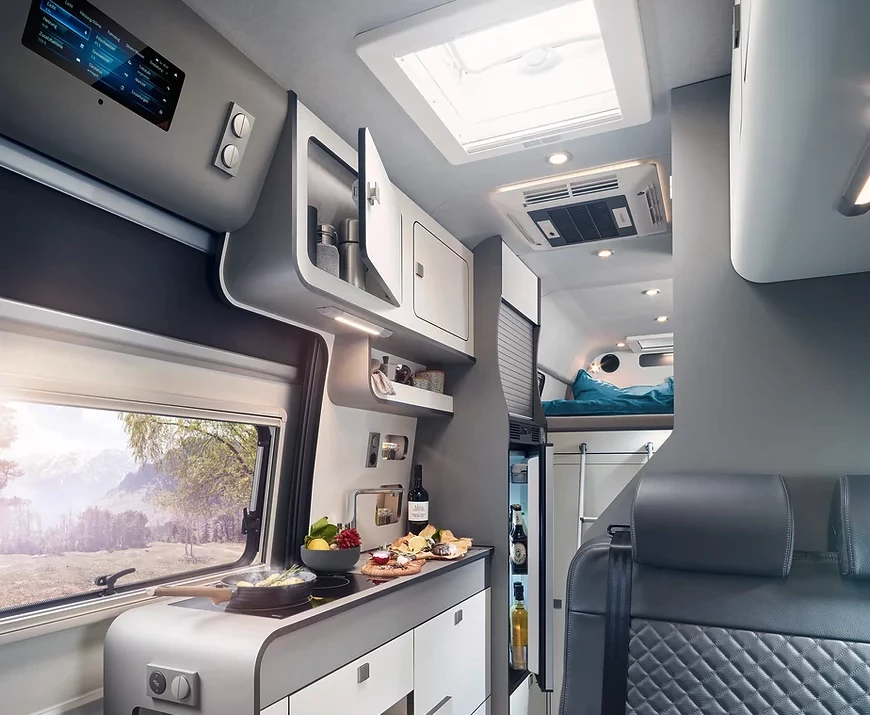 The Alphavan kitchen includes a two-spot induction cooktop and a 90-L Dometic compressor fridge