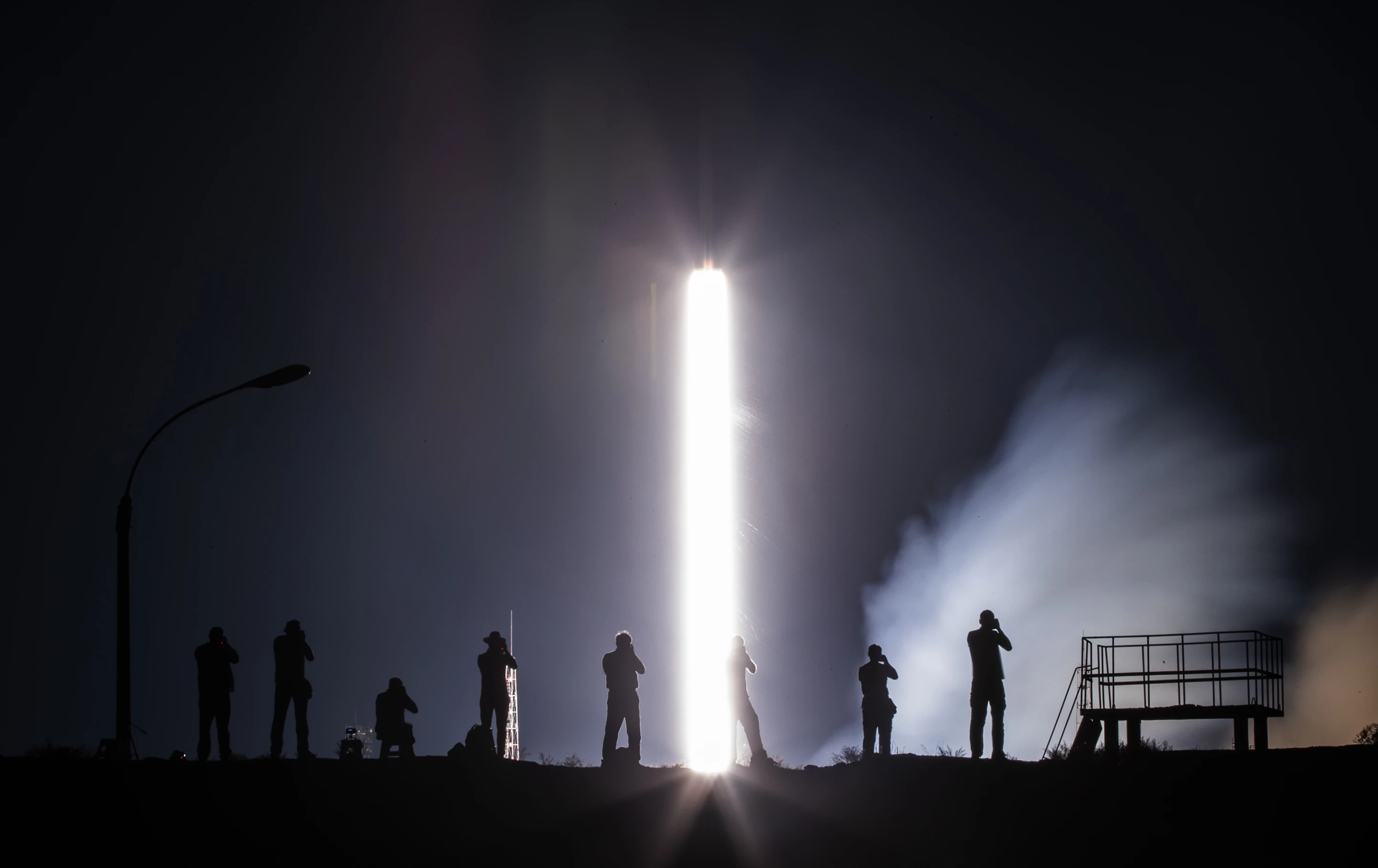 Honorable Mention, Technology/Machine. Photographers take pictures as the Soyuz MS-13 spacecraft takes off in 2019